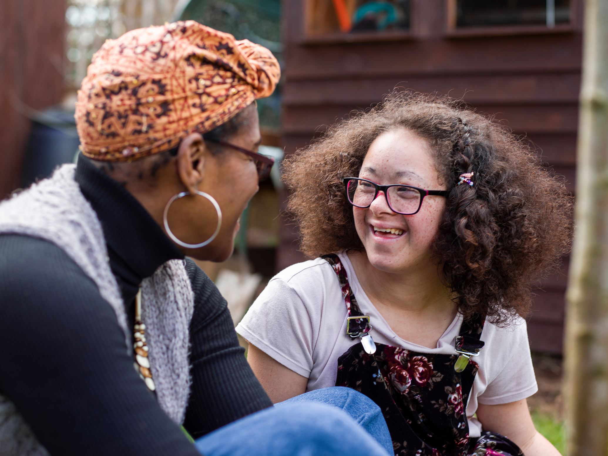 A female Education Mental Health Practitioner talking to a young girl